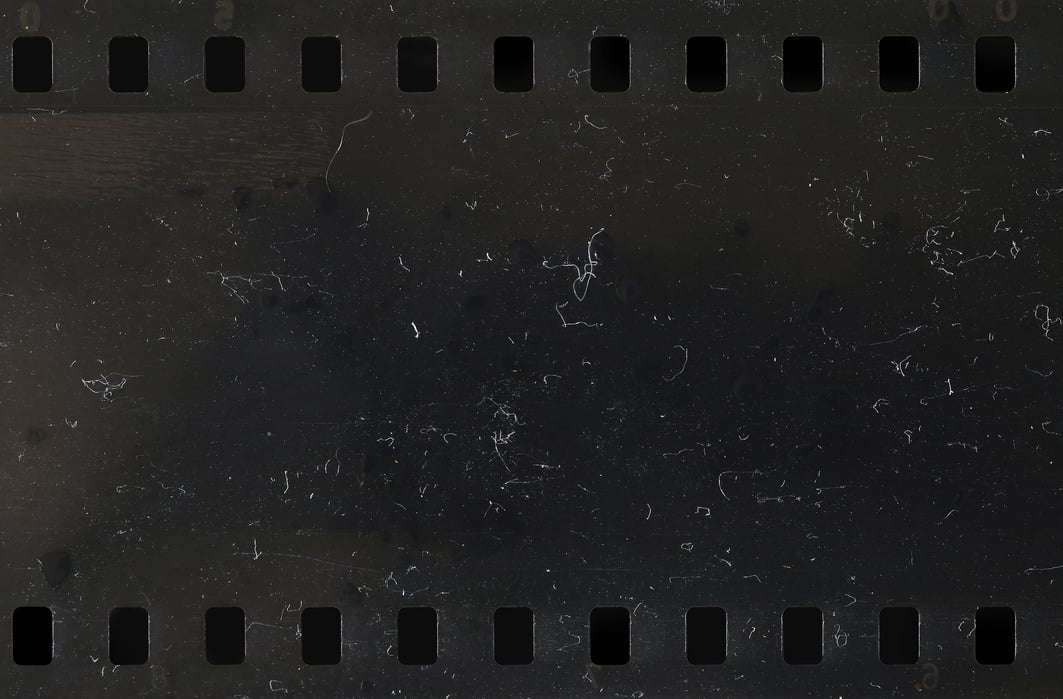 Strip of old celluloid film with dust and scratches